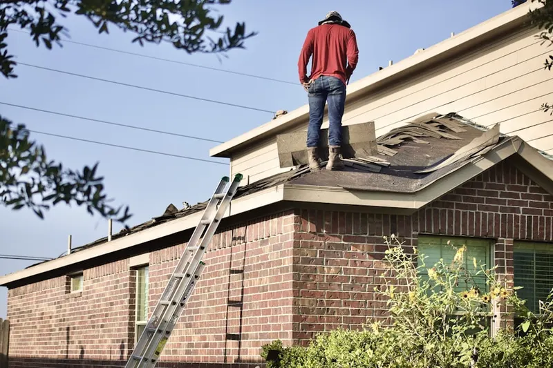 Professional roofer working on a residential roof in Lake Ashton Golf Club